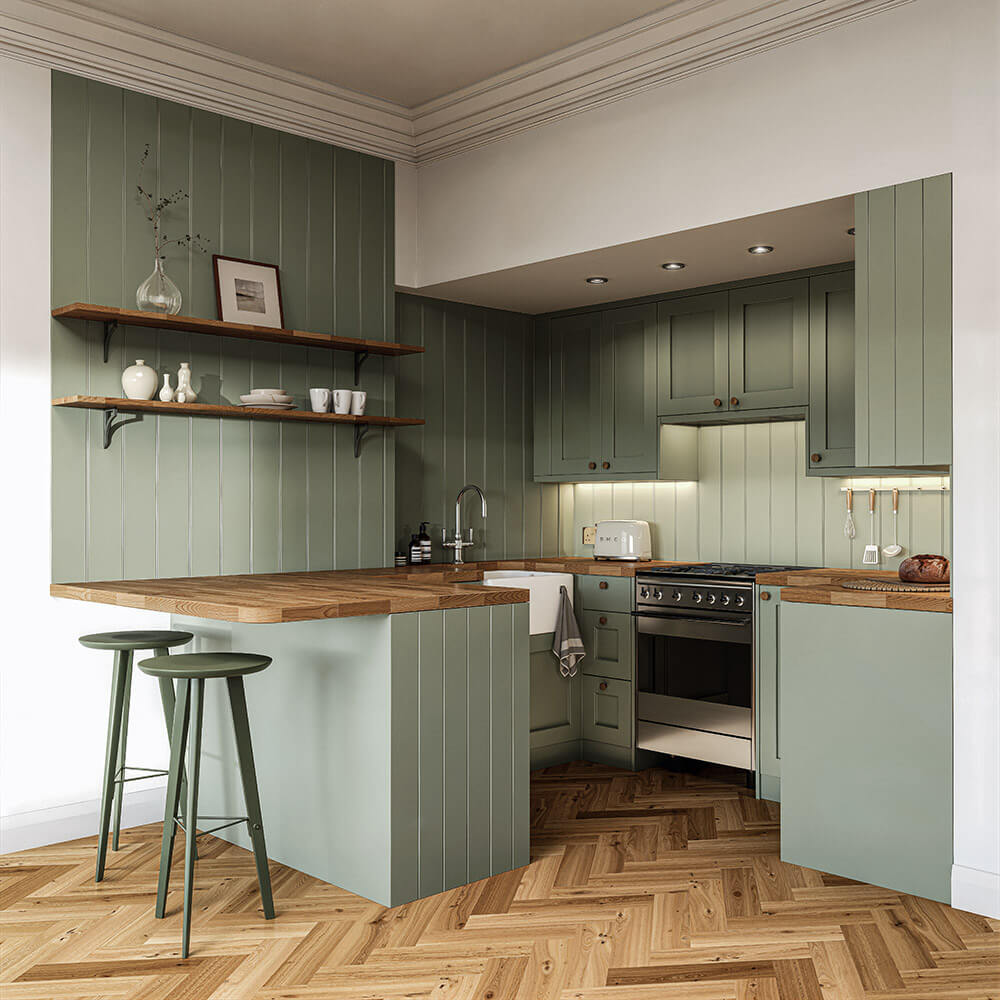 Completed sage green kitchen with oak worktops, shaker cabinetry and Victorian cornicing